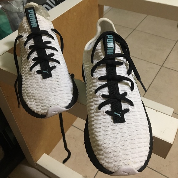 puma defy sneakers in white